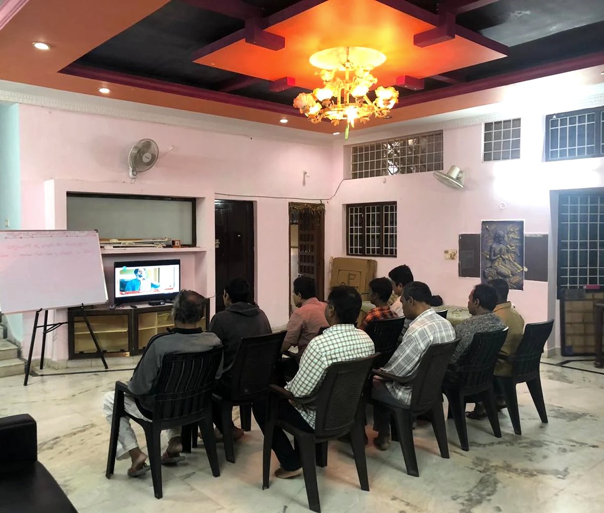 Residents seated together in the centre's common hall during a group therapy session at Solace, Uppal.